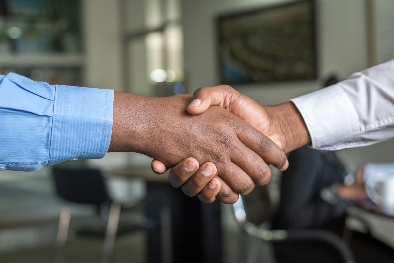 Business handshake in an office meeting