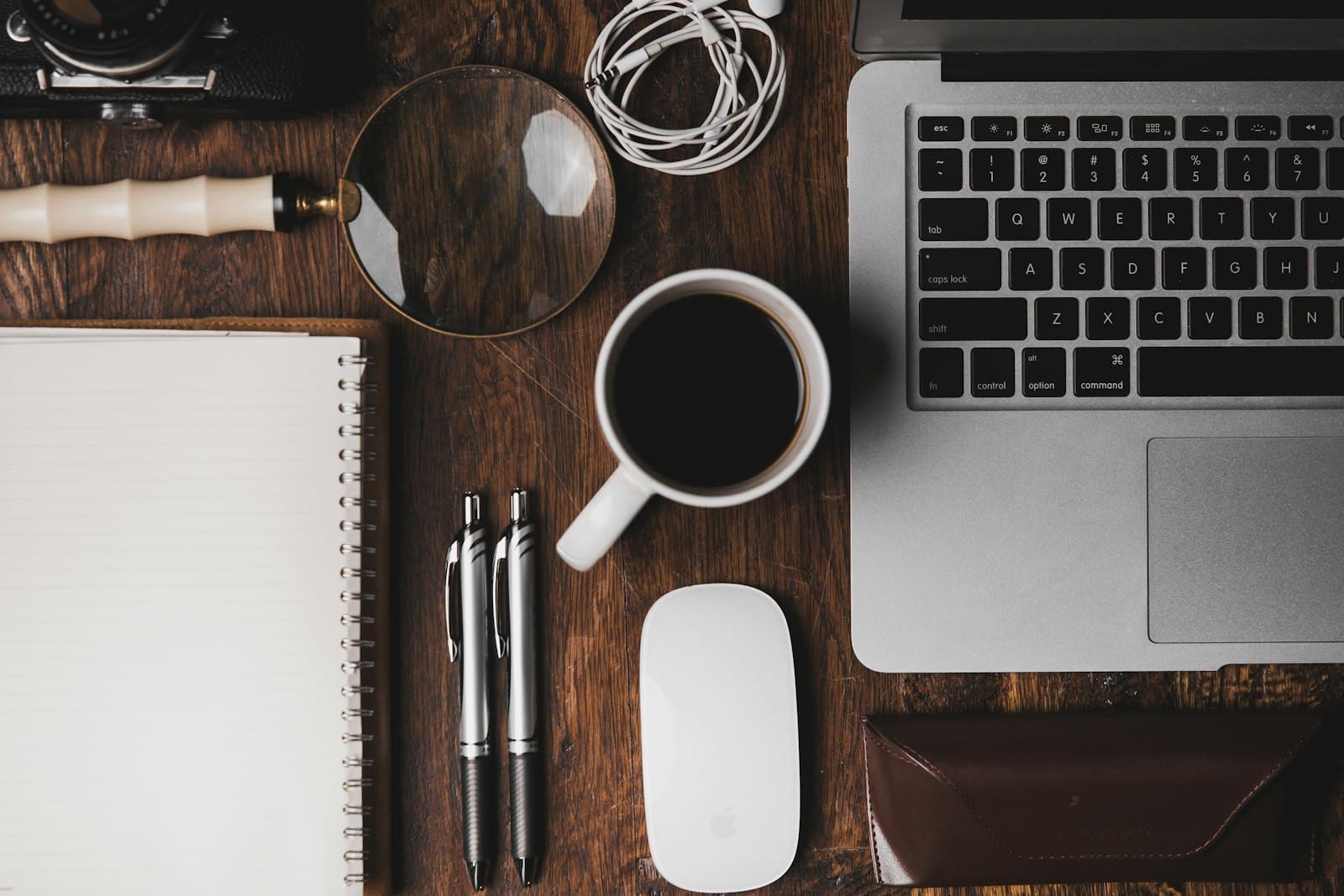 Laptop and coffee on a work desk — applying online